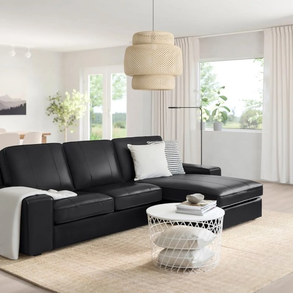 A three person sofa with a nob